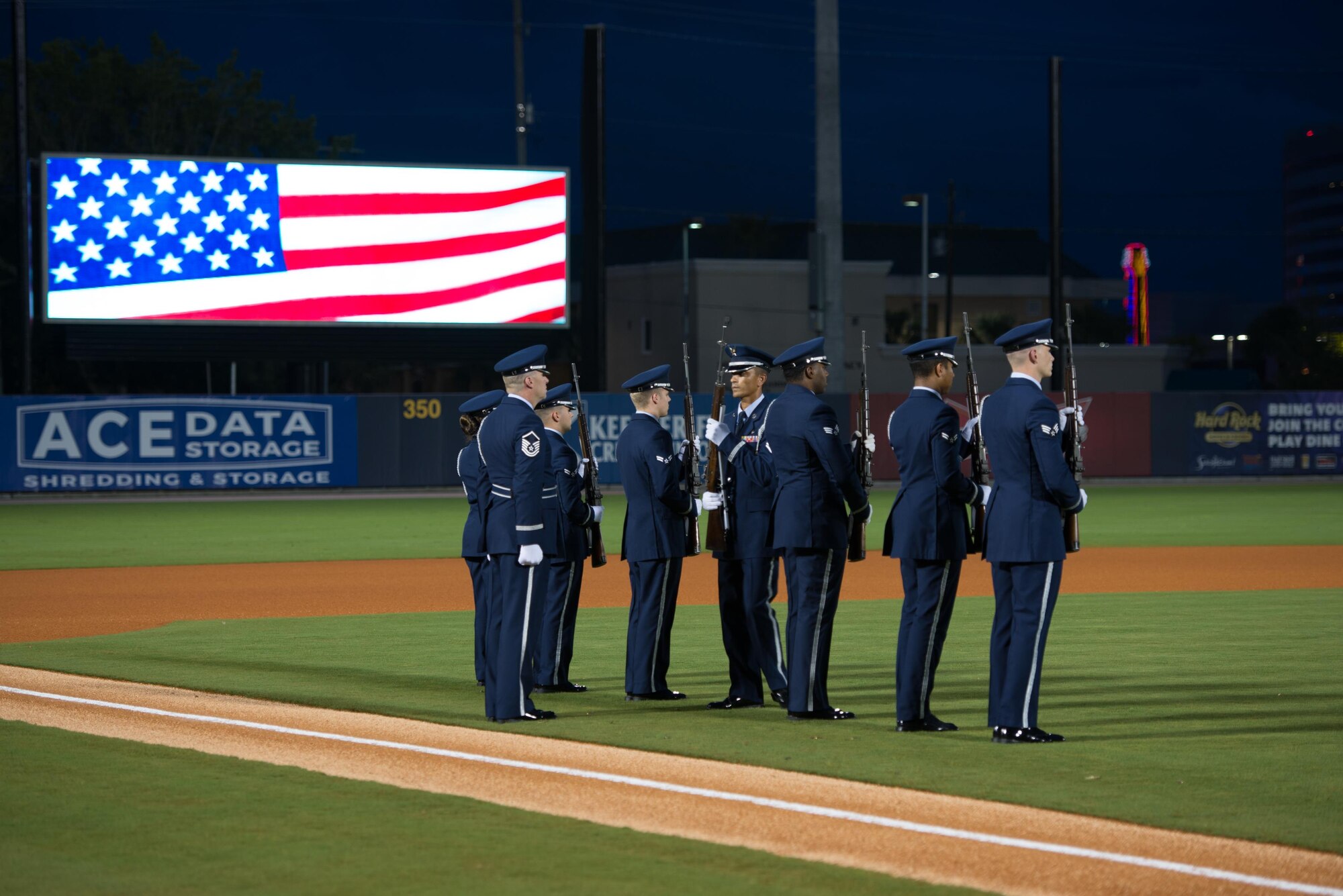 Members of the Keesler Air Force Base Honor Guard perform a 21-gun salute during a remembrance ceremony at the Biloxi Shuckers Minor League Baseball game Sept. 11, 2015, at MGM Park, Biloxi, Miss. The event honored those who lost their lives during the 9/11 attacks. It also included first pitches by a member of the local police department, fire department and each military service branch. The honor guard also performed taps and posted the colors. (U.S. Air Force photo by Marie Floyd)