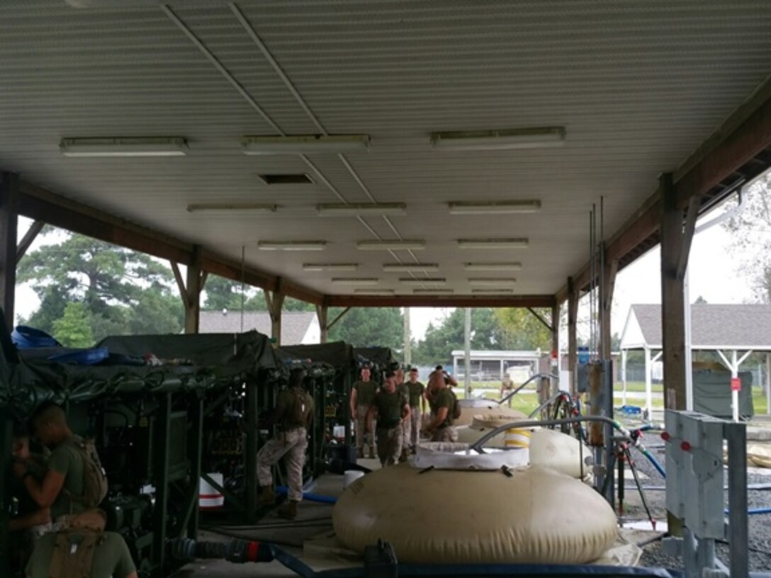 Marines from Basic Water Support Technician course 7-15 participate in a practical application operating the Tactical Water Purification System  (TWPS) at Marine Corps Engineer School, Camp Lejeune, N.C. August 31, 2015.  This training is imperative for the Marines of BWST 7-15, they must master operating the TWPS in order to provide potable water to sustain the Operating Force throughout various operations. 