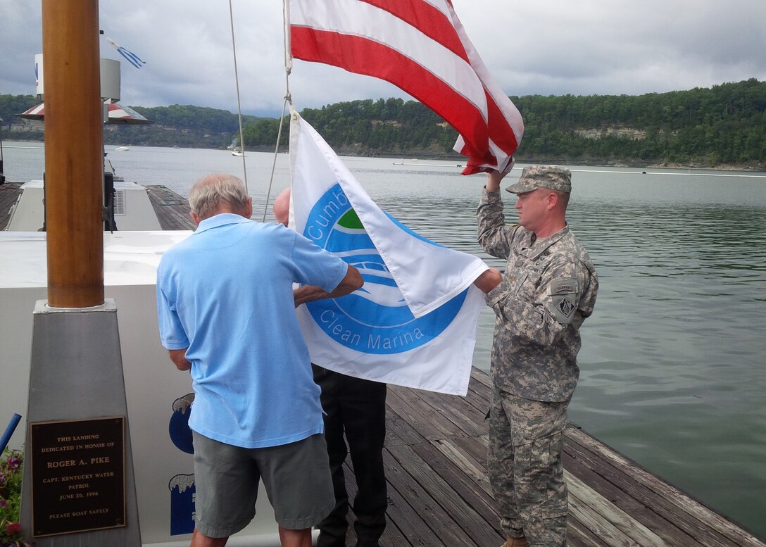 NASHVILLE, TENN., (Sept. 14, 2015)– With the sound of marine boat motors in the background, the U.S. Army Corps of Engineers, Nashville District presented a ‘Clean Marina’ certification flag to a Lake Cumberland marina during a brief ceremony Sept. 10, 2015.   
Conley Bottom Resort in Monticello, Ky., became the first marina on Lake Cumberland to earn the distinguished certification. (USACE Photo) 

