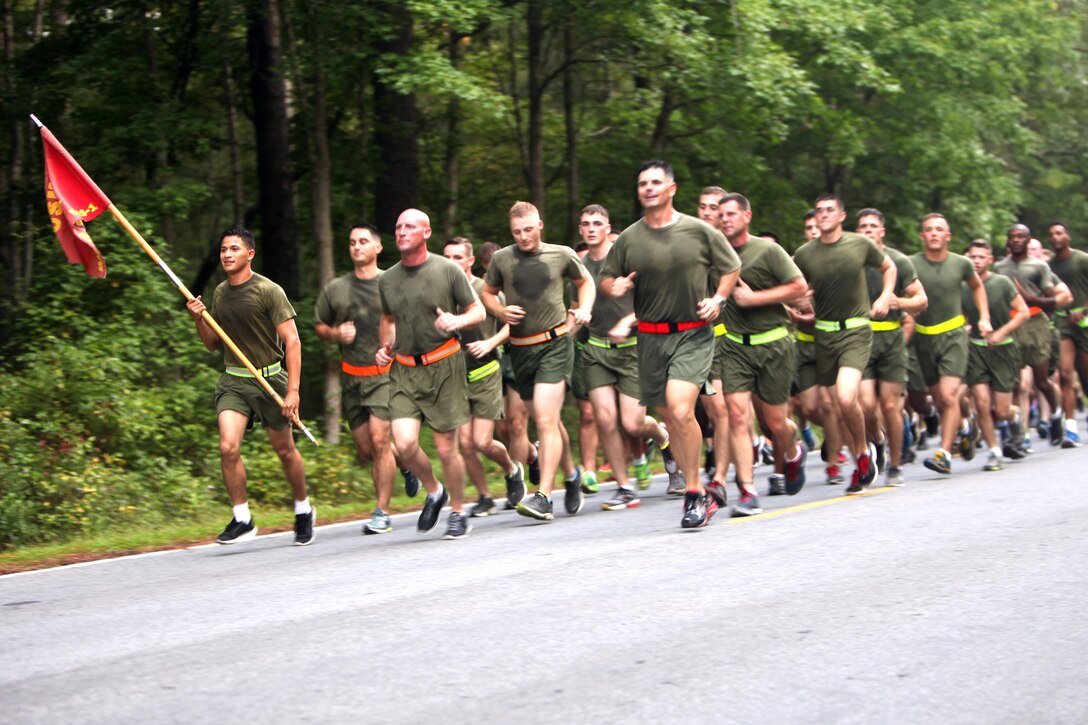 Marine Air Support Squadron 1 runs in formation during a motivational run at Marine Corps Air Station Cherry Point, N.C., Sept. 4, 2015. Marine Air Control Group 28 Marines organized the run to remind Marines to protect themselves and each other from suicide and alcohol abuse, and to stay safe during the Labor Day weekend. (U.S. Marine Corps photo by Pfc. Nicholas P. Baird/ Released) 