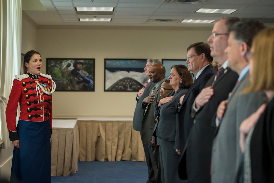 Marine Corps Gunnery Sgt. Sara Dell'omo of the U.S. Marine Band sings the national anthem during the Combined Federal Campaign kickoff ceremony at the Pentagon, Sept. 15, 2015. DoD photo by U.S. Air Force Senior Master Sgt. Adrian Cadiz