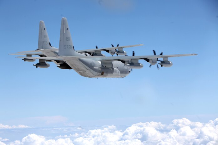 Two KC-130J Super Hercules soar through the skies during a division flight over eastern North Carolina, Sept. 1, 2015. Marine Aerial Refueler Transport Squadron 252 provides the Marine Air-Ground Task Force commander with air-to-air refueling, assault support and offensive air support, day and night under all weather conditions during expeditionary, joint, or combined operations. The squadron has supported these operations since its activation June 1, 1928. VMGR-252 remains the oldest continually active squadron in the Marine Corps. (U.S. Marine Corps photo by Lance Cpl. Jason Jimenez/Released)
