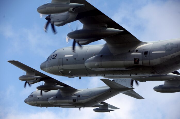 Two KC-130J Super Hercules maneuver through the skies during a division flight over eastern North Carolina, Sept. 1, 2015. Marine Aerial Refueler Transport Squadron 252 provides the Marine Air-Ground Task Force commander with air-to-air refueling, assault support and offensive air support, day and night under all weather conditions during expeditionary, joint, or combined operations. The squadron has supported these operations since its activation June 1, 1928. VMGR-252 remains the oldest continually active squadron in the Marine Corps. (U.S. Marine Corps photo by Lance Cpl. Jason Jimenez/Released)
