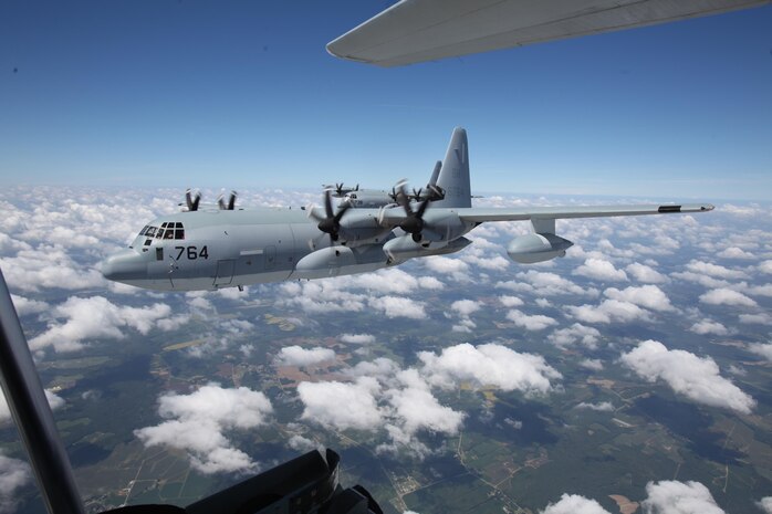 A KC-130J Super Hercules flies above clouds during a division flight over eastern North Carolina, Sept. 1, 2015. Marine Aerial Refueler Transport Squadron 252 provides the Marine Air-Ground Task Force commander with air-to-air refueling, assault support and offensive air support, day and night under all weather conditions during expeditionary, joint, or combined operations. The squadron has supported these operations since its activation June 1, 1928. VMGR-252 remains the oldest continually active squadron in the Marine Corps. (U.S. Marine Corps photo by Lance Cpl. Jason Jimenez/Released)