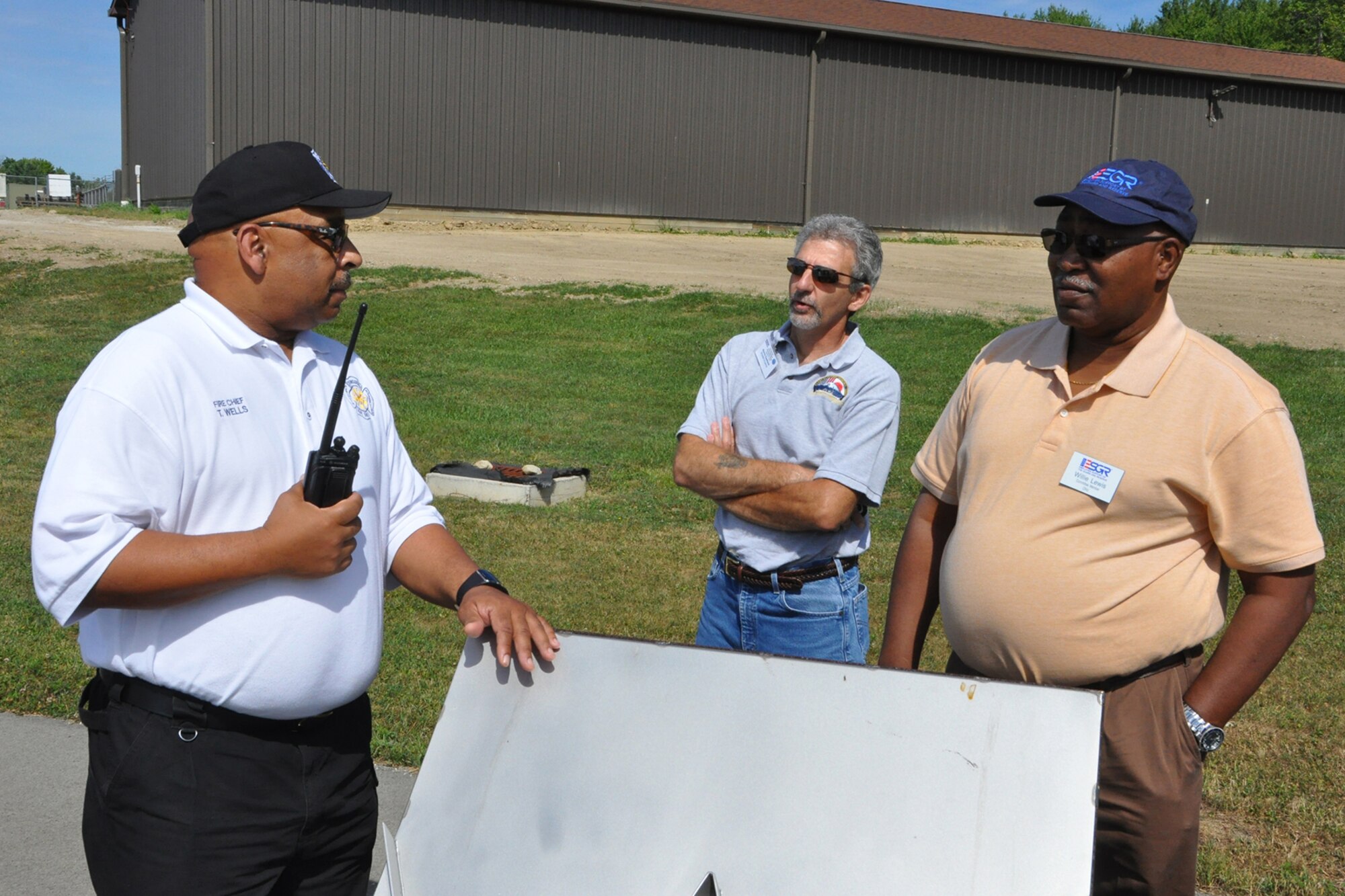 910th Civil Engineer Fire Department Chief Anthony Wells talks with attendees during the 3rd Annual Joint Employer Awareness Event about an aircraft fire fighting demonstration they are about to witness here, Aug. 7, 2015. The two-day event, designed to give civilian employers of Air Force Reservists and Ohio National Guardsmen a better understanding of the mission their employees carry out as members of the U.S. Armed Forces, also gave attendees the opportunity to get an up-close look at both the Ohio National Guard's Joint Military Training Center here and the 910th Airlift Wing's facilities at nearby Youngstown Air Reserve Station, Ohio. (U.S. Air Force photo/Master Sgt. Bob Barko Jr.)