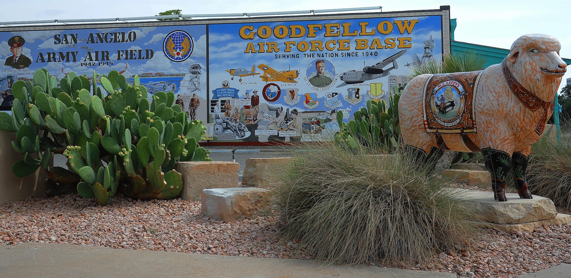 The Military Mural, located in downtown San Angelo, depicts the heritage of Goodfellow Air Force Base, Texas, Sept. 9, 2015. The mural depicts the beginnings of the Air Force in San Angelo with the San Angelo Army Air Field with historical aircraft and buildings, like the AT-11 Bomb Trainer and the Sante Fe Orient Depot with crowds of GI’s waiting for the train to San Angelo.  (U.S. Air Force photo by Airman Caelynn Ferguson/Released)