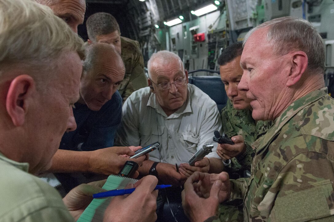 U.S. Army Gen. Martin E. Dempsey, right, chairman of the Joint Chiefs of Staff, talks to reporters after visiting with leaders and service members supporting the NATO-led Resolute Support mission in Kabul, Afghanistan, July 19, 2015. DoD photo by U.S. Navy Petty Officer 1st Class Daniel Hinton