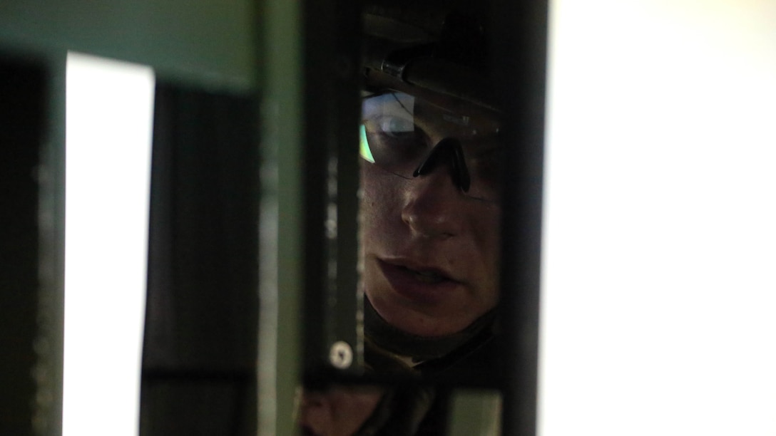 Cpl. Ian M. Keyser looks through a rear view mirror during a combat convoy simulator at Marine Corps Base Camp Lejeune, N.C., Sept. 9, 2015. Marines with 2nd Low Altitude Air Defense Battalion tested their combat skills and decision making as they maneuvered through a simulated desert, mimicking the possible scenarios they could encounter while in a real-life scenario. The training simulator allowed the Marines to efficiently train in a controlled environment without sacrificing safety or accuracy. Keyser is a low altitude air defense gunner with 2nd LAAD based out of Marine Corps Air Station Cherry Point, N.C. 
