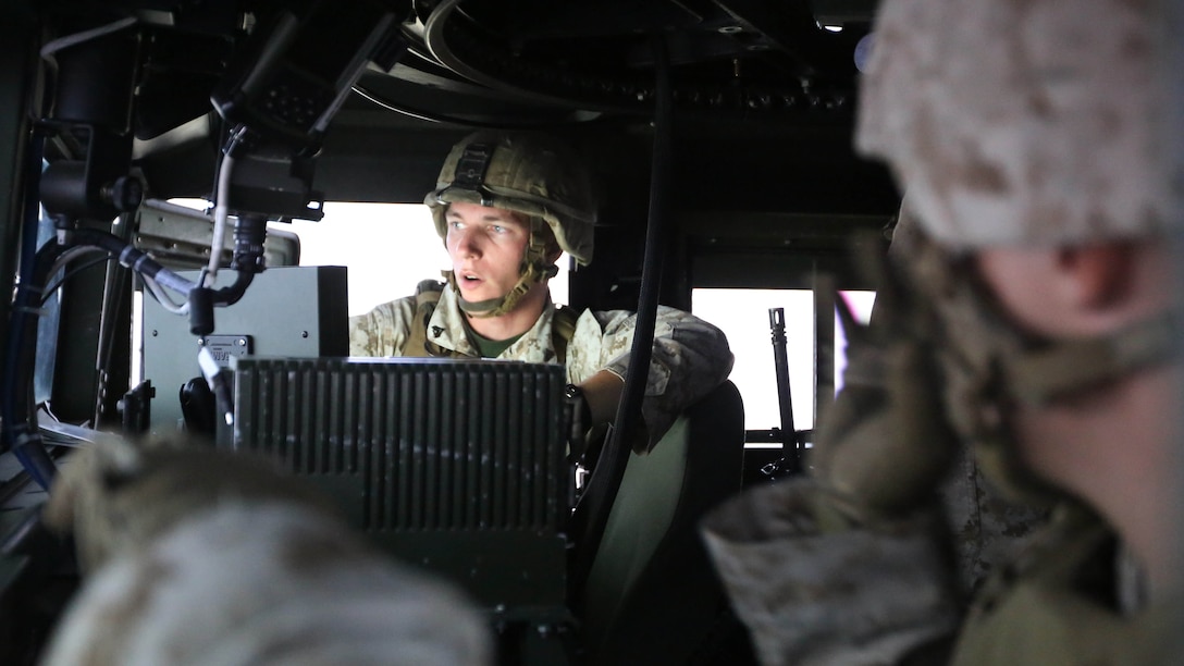 Cpl. Ian M. Keyser briefs members of his convoy on their mission during a combat convoy simulator at Marine Corps Base Camp Lejeune, N.C., Sept. 9, 2015. Marines with 2nd Low Altitude Air Defense Battalion tested their combat skills and decision making as they maneuvered through a simulated desert, mimicking the possible scenarios they could encounter while in a real-life scenario. The training simulator allowed the Marines to efficiently train in a controlled environment without sacrificing safety or accuracy. Keyser is a low altitude air defense gunner with 2nd LAAD based out of Marine Corps Air Station Cherry Point, N.C. 