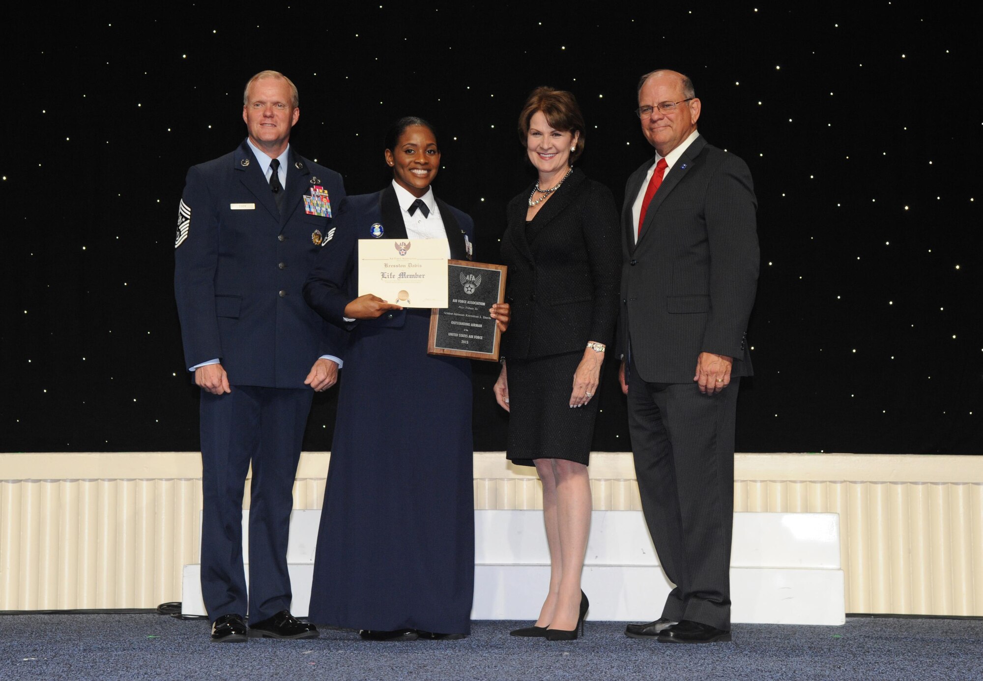Chief Master Sgt. of the Air Force James A. Cody, left, poses with Staff Sgt. Kresston Davis, Marillyn Hewson, CEO of Lockheed Martin and Scott Van Cleef, Air Force Association Chairman of the Board. Hewson and Van Cleef had just presented Davis with her Outstanding Airman of the Year plaque and a certificate for a lifetime AFA membership. The Air Force Association officially recognized Davis Sept. 14 as one of the 12 Outstanding Airmen of the Year for 2015. Davis, from the 908th Airlift Wing's Security Forces Squadron, Maxwell Air Force Base, Alabama, received her plaque as a part of the association's annual conference at the Gaylord Hotel in Washington D.C. Davis said participating in the 12 Outstanding Airmen events has allowed her to do things she probably never would have had the opportunity to do. She said she has met many leaders from across the Air Force as well as those
from business and government. (US Air Force photo/Lt Col Jerry Lobb)
