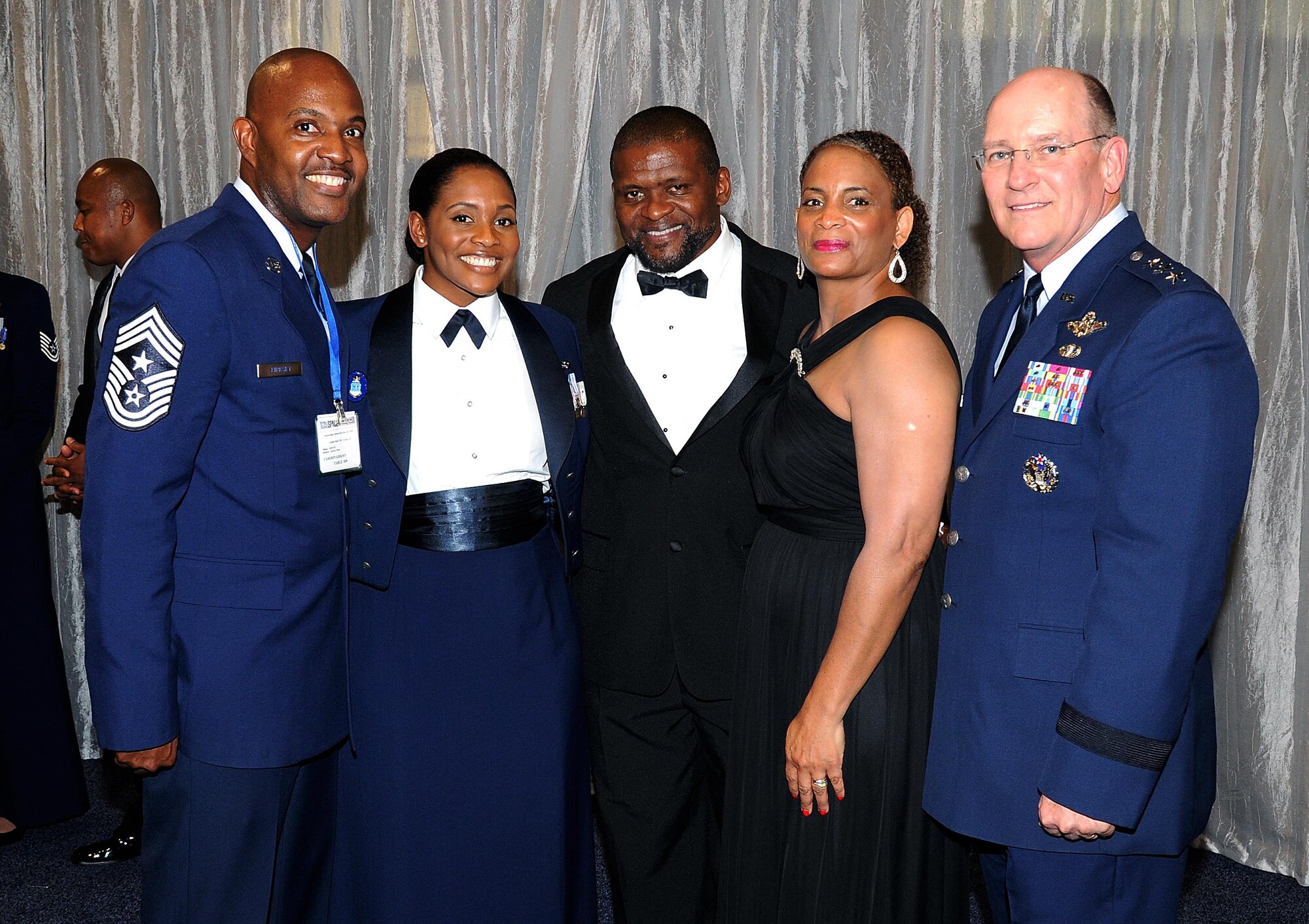 Staff Sgt. Kresston Davis and her parents, Leroy and Angela Davis, are joined on the receiving line by Air Force Reserve Command Chief  Cameron Kirksey and AFRC Commander Lt Gen. J. J. Jackson. The Air Force Association officially recognized Davis Sept. 14 as one of the 12 Outstanding Airmen of the Year for 2015. Davis, from the 908th Airlift Wing's Security Forces Squadron, Maxwell Air Force Base, Alabama, received her plaque as a part of the association's annual conference at the Gaylord Hotel in Washington D.C.  Davis said participating in the 12 Outstanding Airmen events has allowed her to do things she probably never would have had the opportunity to do. She said she has met many leaders from across the Air Force as well as those
from business and government. (US Air Force photo/Lt Col Jerry Lobb)

