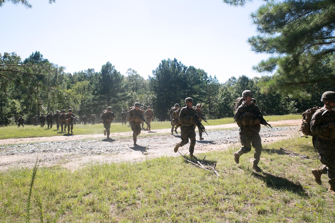 Marines from Marine Barracks Washington, D.C.  practice boarding an MV-22B, Osprey, at Landing Zone Crane, Marine Corps Base Quantico, Va., Sept. 14, 2015.The Marines spent four days training in Quantico before being extracted to Training Area, AP Hill, Va. where they will continue to hone their skills. (U.S. Marine Corps photo by Cpl. Christian Varney/Released)
