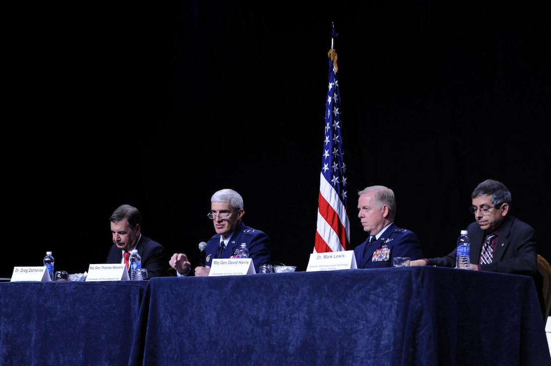 Members of the imperative for innovation in a time of austerity panel speaks to a crowd during the Air Force Association Air and Space Conference and Technology Exposition in Washington, D.C. Sept. 14, 2015. The conference focuses on bringing the Air Force together through leadership, industry experts and aerospace specialists to discuss issues and challenges facing America and the aerospace community. (Air Force photo/Staff Sgt. Whitney Stanfield)