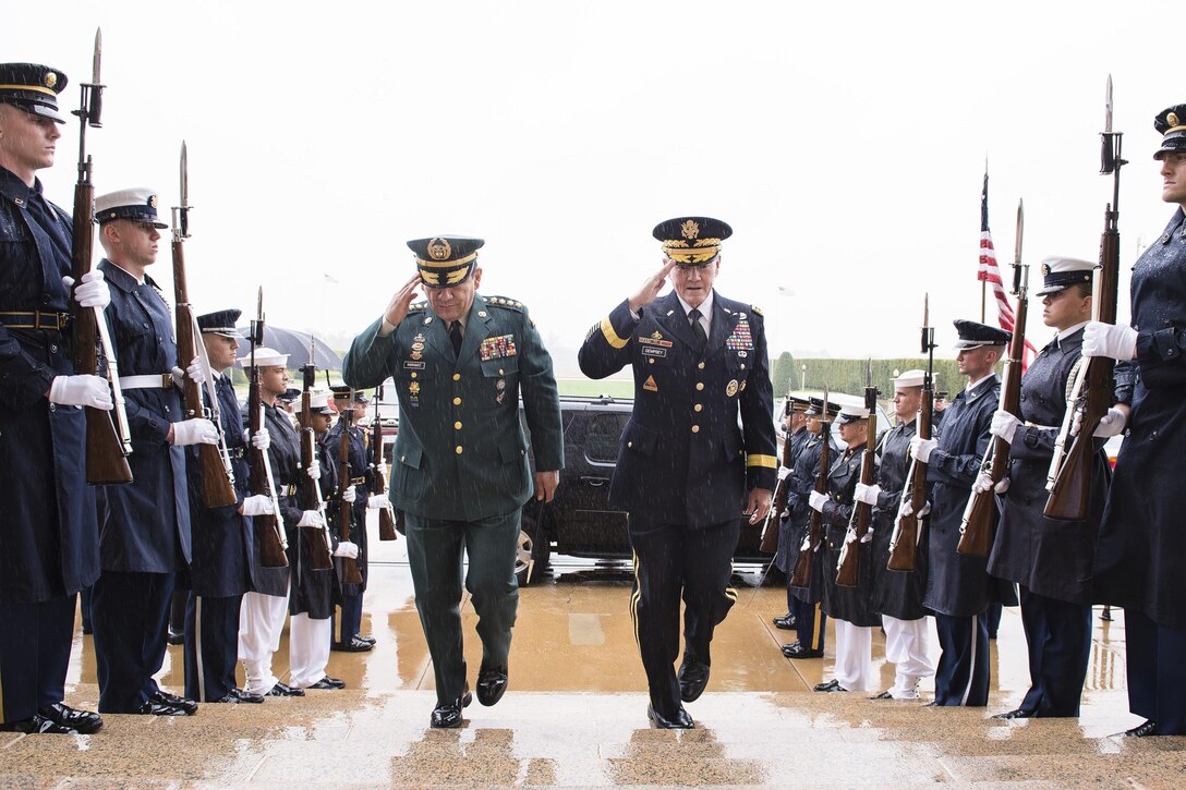 U.S. Army Gen. Martin E. Dempsey, right, chairman of the Joint Chiefs of Staff, welcomes Colombian Army Gen. Juan Pablo Rodriguez Barragan, chief of Colombia's Joint Chiefs of Staff, to the Pentagon, Sept. 25, 2014. The two defense leaders met to discuss issues of mutual importance. DoD photo by U.S. Army Staff Sgt. Sean K. Harp
