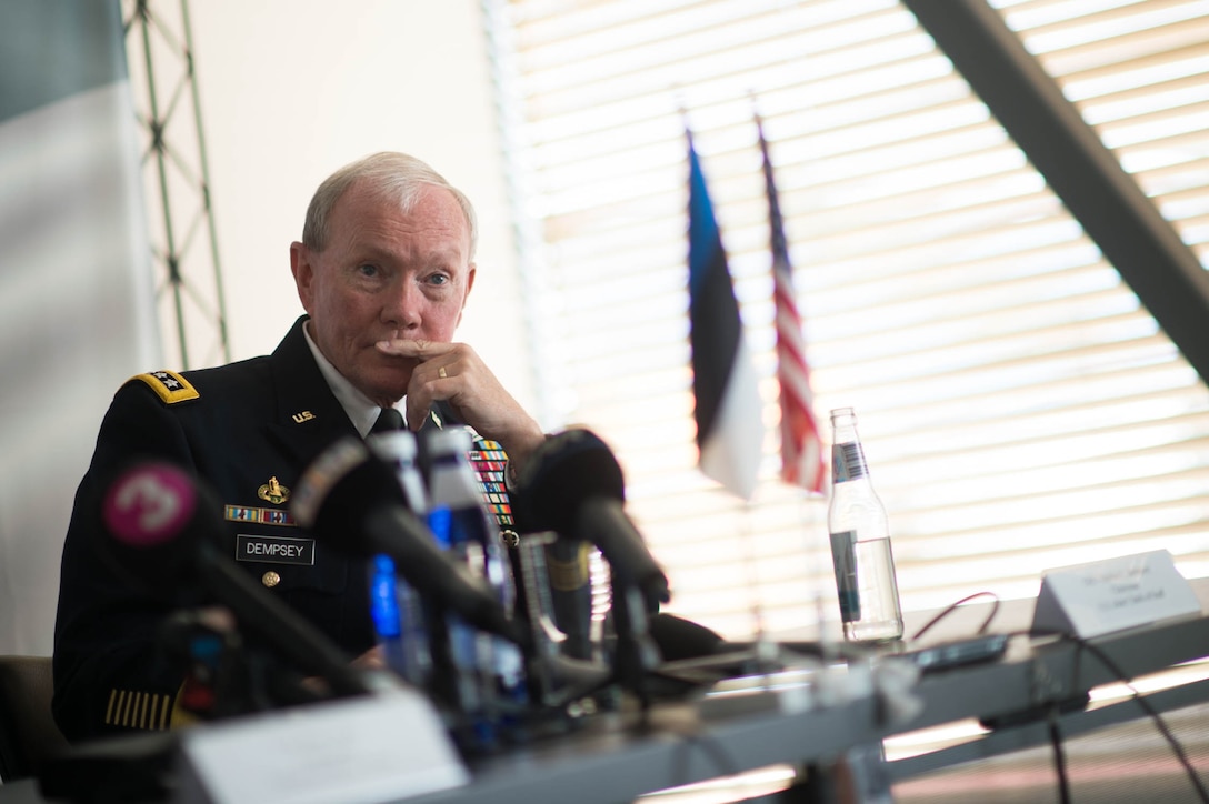 U.S. Army Gen. Martin E. Dempsey, chairman of the Joint Chiefs of Staff, listens to a reporter's question during a press conference with Estonian Lt. Gen. Riho Terras, commander of the Estonian Defense Forces, in Tallinn, Estonia, Sept. 14, 2015. DoD photo by D. Myles Cullen