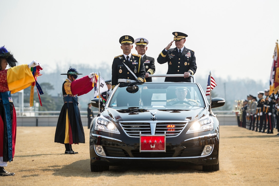 U.S. Army Gen. Martin E. Dempsey, right, chairman of the Joint Chiefs of Staff, and his South Korean counterpart, Adm. Choi Yun-hee, participate in a pass in review during an honor ceremony at the South Korean Joint Chiefs of Staff headquarters in Seoul, South Korea, March 27, 2015. DoD photo by U.S. Navy Petty Officer 1st Class Daniel Hinton