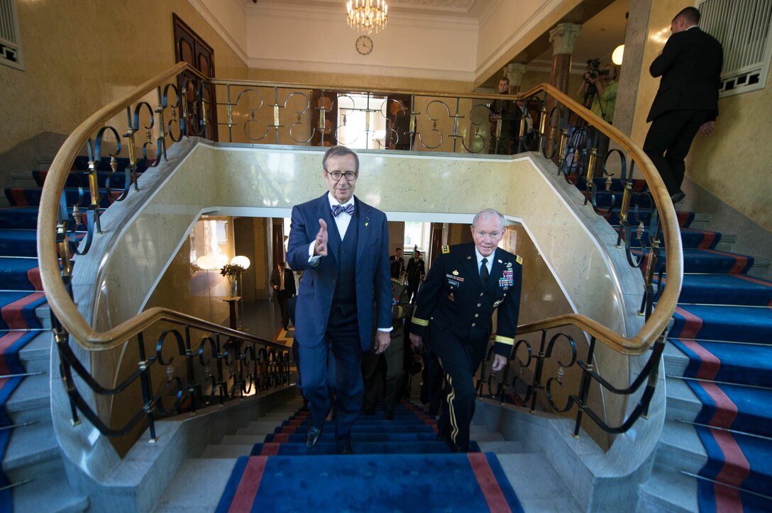 U.S. Army Gen. Martin E. Dempsey, right, chairman of the Joint Chiefs of Staff, walks with Estonian President Toomas Hendrik Ilves at the presidential palace in Tallinn, Estonia, Sept. 15, 2015. DoD photo by D. Myles Cullen