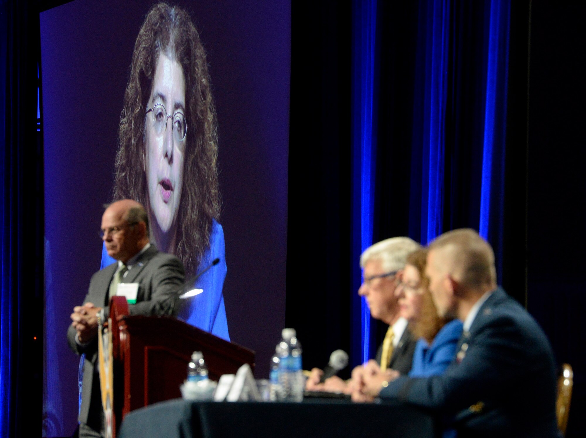 Michelle S. LoweSolis, Director of Plans and Integration, Deputy Chief of Staff for Manpower and Personnel, answers a question with panelists Principal Deputy Assistant Secretary of the Air Force Daniel R. Sitterly, and Air University Commander and President Lt. Gen. Steven L. Kwast, during a discussion about "Human Capital Plan," at the Air Force Association Air and Space Conference and Technology Exposition, Sept. 15, 2015, in Washington, D.C.  The Air Force experts talked about the way-ahead for equipping, training and growing future Airmen. (U.S. Air Force photo by Scott M. Ash)