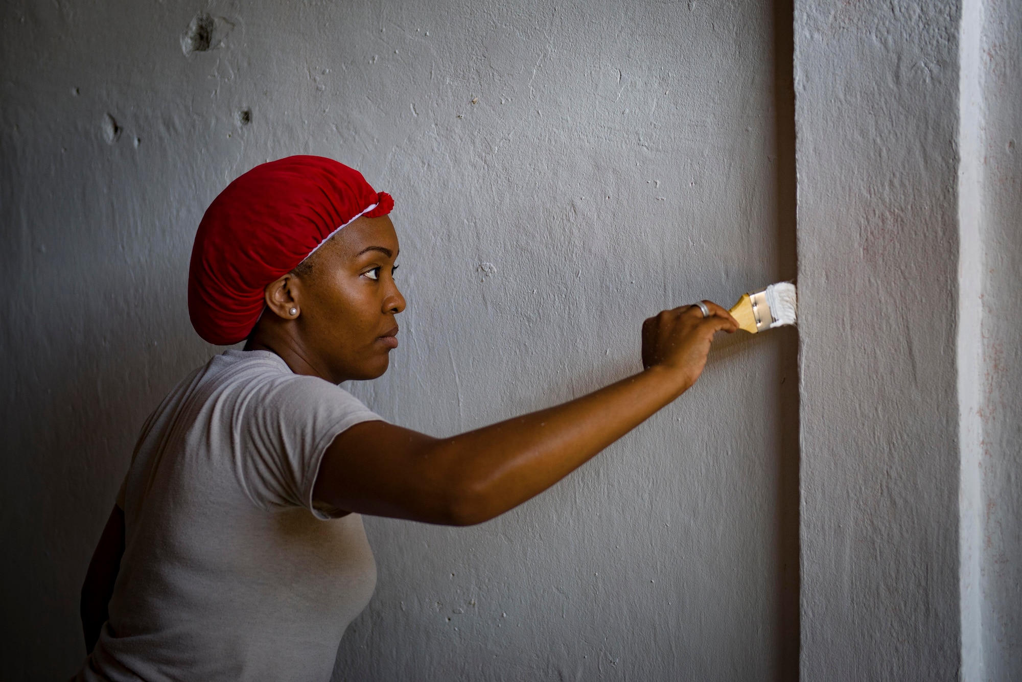 Tech. Sgt. Latrisha Skinner, Pacific Angel 15-2 optometrist, helps paint a health university building during a PACANGEL engineering project Sept 12, 2015, in Baucau, Timor-Leste. Efforts undertaken during Pacific Angel help multilateral militaries in the Pacific improve and build relationships across a wide spectrum of civic operations, which bolsters each nation’s capacity to respond and support future humanitarian assistance and disaster relief operations. (U.S. Air Force photo by Staff Sgt. Alexander W. Riedel/Released)