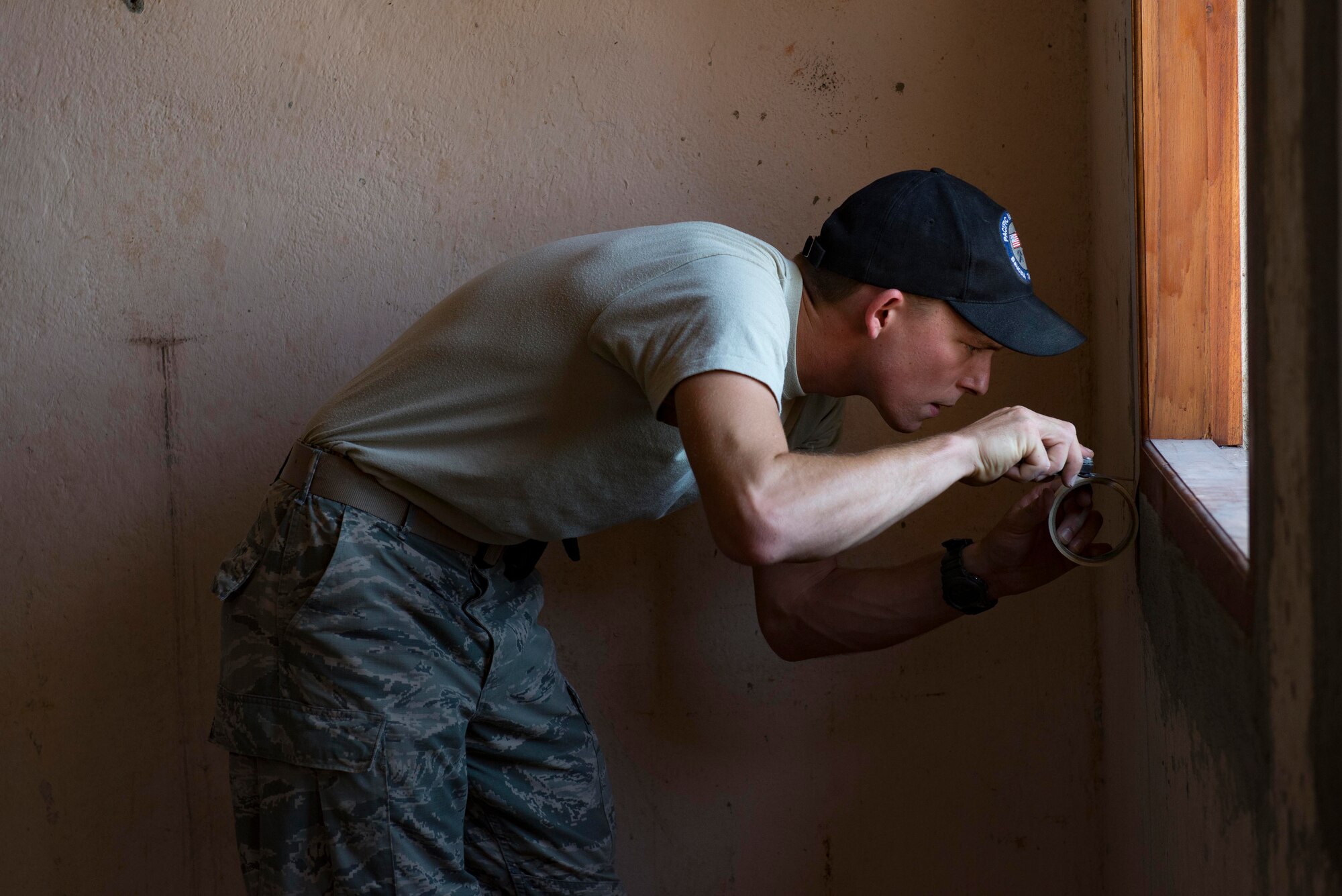 Airman 1st Class Benjamin Joyce, 35th Civil Engineer Squadron carpenter, tapes a window frame before a room is painted during a Pacific Angel 15-2 engineering project Sept 12, 2015, in Baucau, Timor-Leste. Efforts undertaken during Pacific Angel help multilateral militaries in the Pacific improve and build relationships across a wide spectrum of civic operations, which bolsters each nation’s capacity to respond and support future humanitarian assistance and disaster relief operations. (U.S. Air Force photo by Staff Sgt. Alexander W. Riedel/Released)