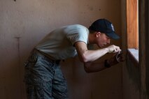 Airman 1st Class Benjamin Joyce, 35th Civil Engineer Squadron carpenter, tapes a window frame before a room is painted during a Pacific Angel 15-2 engineering project Sept 12, 2015, in Baucau, Timor-Leste. Efforts undertaken during Pacific Angel help multilateral militaries in the Pacific improve and build relationships across a wide spectrum of civic operations, which bolsters each nation’s capacity to respond and support future humanitarian assistance and disaster relief operations. (U.S. Air Force photo by Staff Sgt. Alexander W. Riedel/Released)