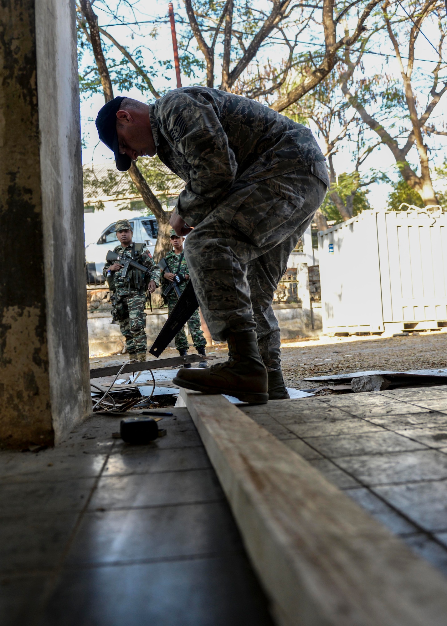 Tech. Sgt. Stephane Beck, Pacific Angel 15-2 structures technician, shortens a wood beam during a PACANGEL construction project Sept. 5, 2015, in Baucau, Timor-Leste. Efforts undertaken during Pacific Angel help multilateral militaries in the Pacific improve and build relationships across a wide spectrum of civic operations, which bolsters each nation’s capacity to respond and support future humanitarian assistance and disaster relief operations. (U.S. Air Force photo by Staff Sgt. Alexander W. Riedel/Released)