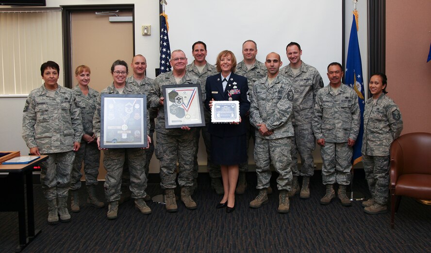 TRAVIS AIR FORCE BASE, Calif. -- Senior Master Sgt. Andrea Harris, 45th Aerial Port Squadron, is honored in a retirement ceremony at Travis AFB, Calif., Sept. 12, 2015.  (U.S. Air Force photo/Lt. Col. Robert Couse-Baker/Released)