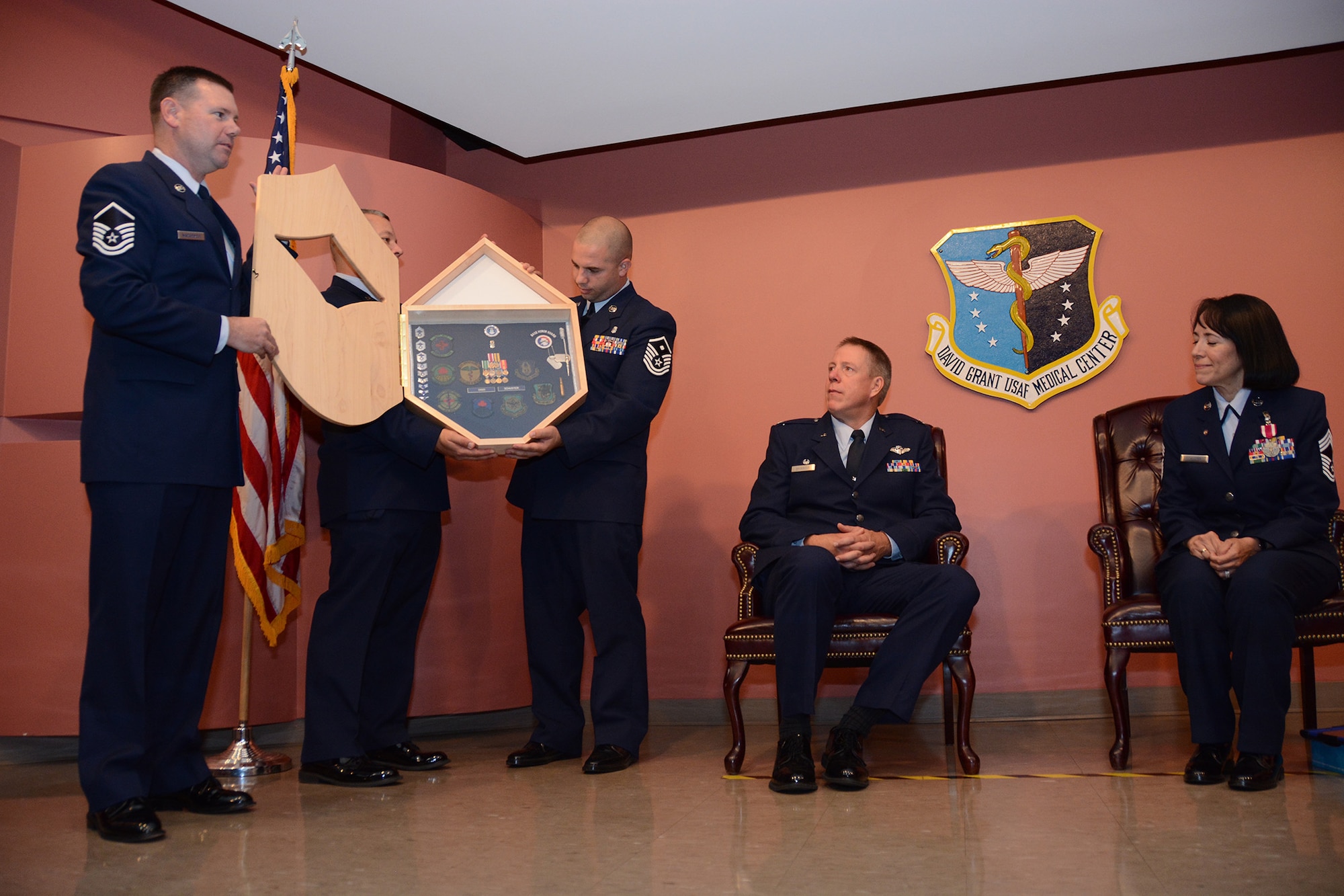 TRAVIS AIR FORCE BASE, Calif. -- Chief Master Sgt. Lastenita Schuster, 349th Aeromedical Staging Squadron superintendent, retires after 33 years of service in the United States Air Force, Sept. 12, 2015.  (U.S. Air Force photo/Senior Airman Madelyn Brown)