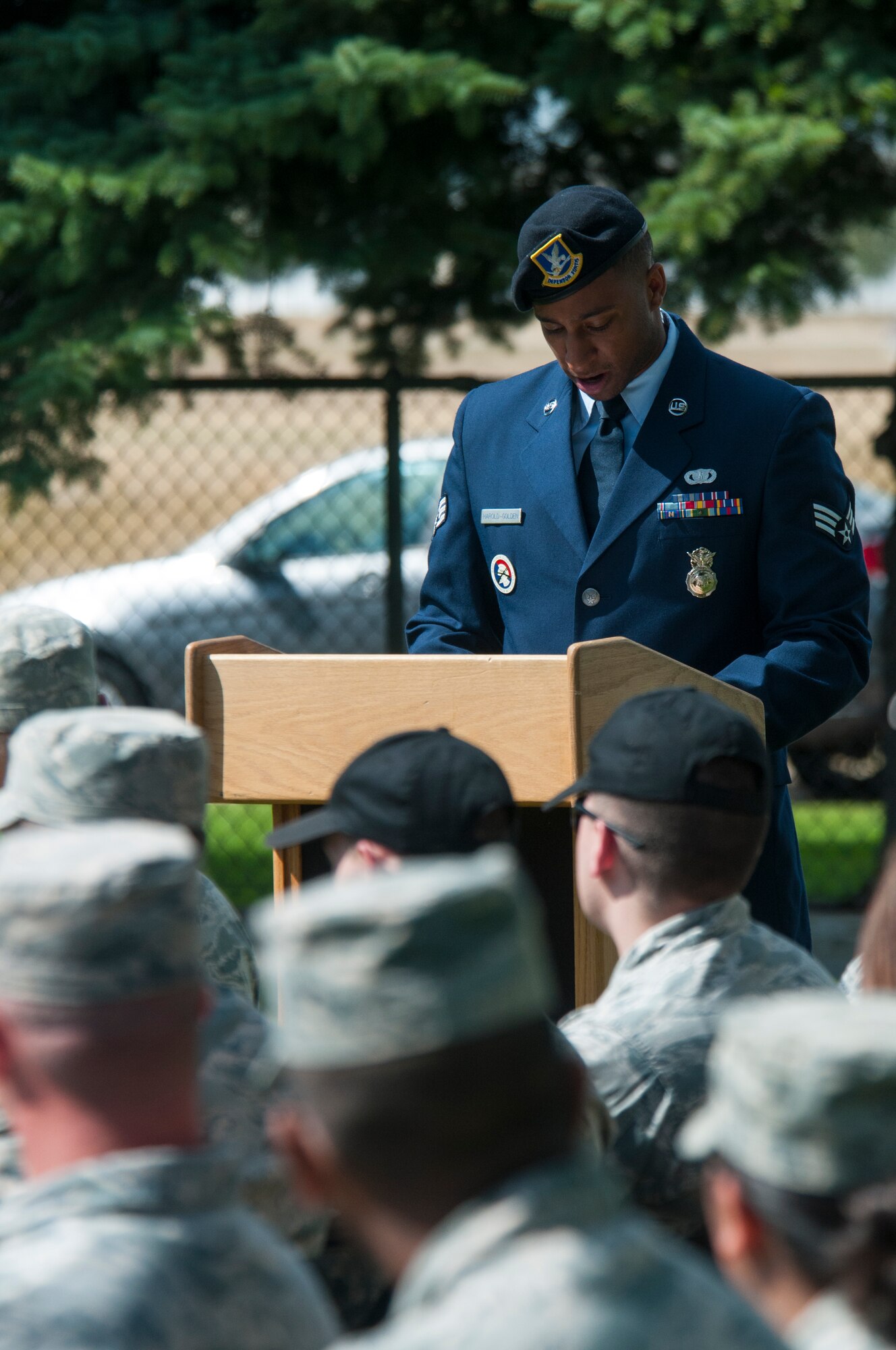 Senior Airman Darren Haroldgolden, 790th Missile Security Forces Squadron response force leader and 90th Missile Wing ceremonial guardsman, addresses the audience attending the 90th MW Honor Guard graduation ceremony Sept. 11, 2015, in the F.E. Warren Air Force Base, Wyo., cemetery. spoke of the need for professionalism like that shown by ceremonial guardsmen in light of the reminder on Sept. 11 of the grievous attacks against the U.S. in 2001. (U.S. Air Force photo by Senior Airman Jason Wiese)