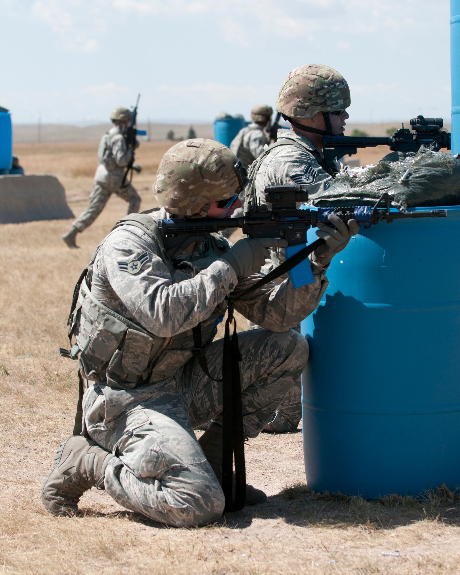Airmen participate in the Shoot Move and Communicate challenge portion of the 2015 Crow Creek Challenge, Sept. 11, 2015, on F.E. Warren Air Force Base, Wyo. All events during the competition required teamwork to accomplish. (U.S. Air Force photo by Airman 1st Class Malcolm Mayfield)
