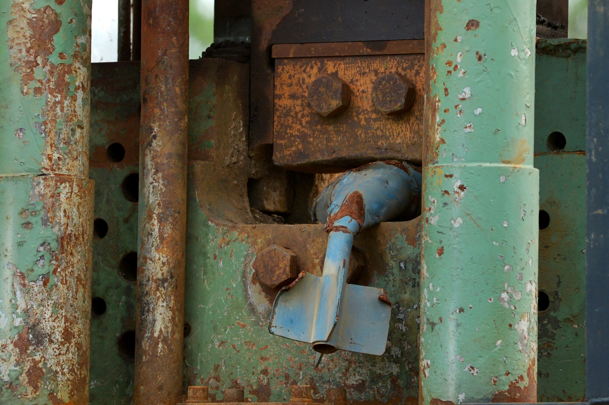 A machine used by the contractors crushes a BDU-33 bomb during a demilitarizing process for munitions dropped at Poinsett Electronic Combat Range, Wedgefield, S.C., Aug. 20, 2015. In Fiscal Year 2012 and 2013, eight ranges assigned to Air Combat Command, Air Force Special Operations Command, and the Air National Guard, processed 6,087 tons of munitions and target debris bringing in approximately $1.24 million to the Air Force. (U.S. Air Force photo by Senior Airman Diana M. Cossaboom/Released)