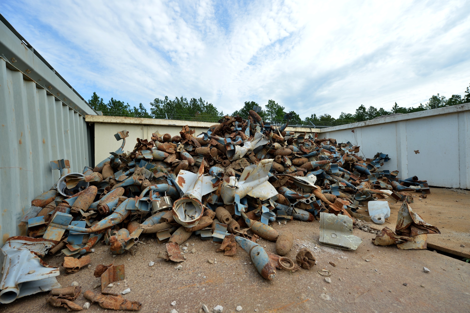 A pile of BDU-33 bombs waiting to be demilitarized sit in the residue area at Poinsett Electronic Combat Range, Wedgefield, S.C., Aug. 20, 2015. An important part of the recycling process is to demilitarize the munitions so they cannot be reused. (U.S. Air Force photo by Senior Airman Diana M. Cossaboom/Released)