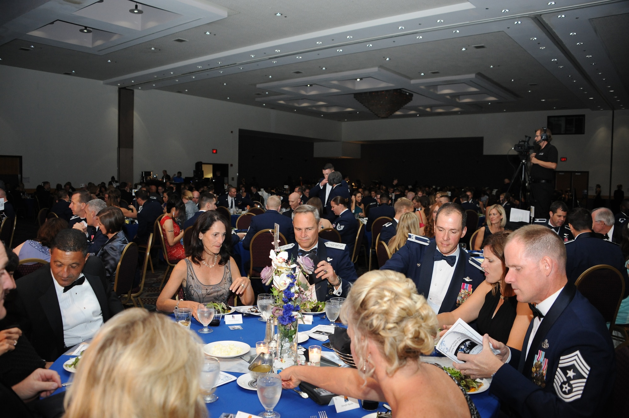 U.S. Airmen from Davis-Monthan Air Force Base dine at the Air Force Ball at the Tucson Convention Center, in Tucson, Ariz., Sept. 12, 2015. Attendees dined while emcees performed musical skits that rehashed D-Ms history and influence beginning in 1925 as an airfield, to 1941 when it was converted into an Army Air Base. (U.S. Air Force photo by Airman 1st Class Ashley N. Steffen/Released)  