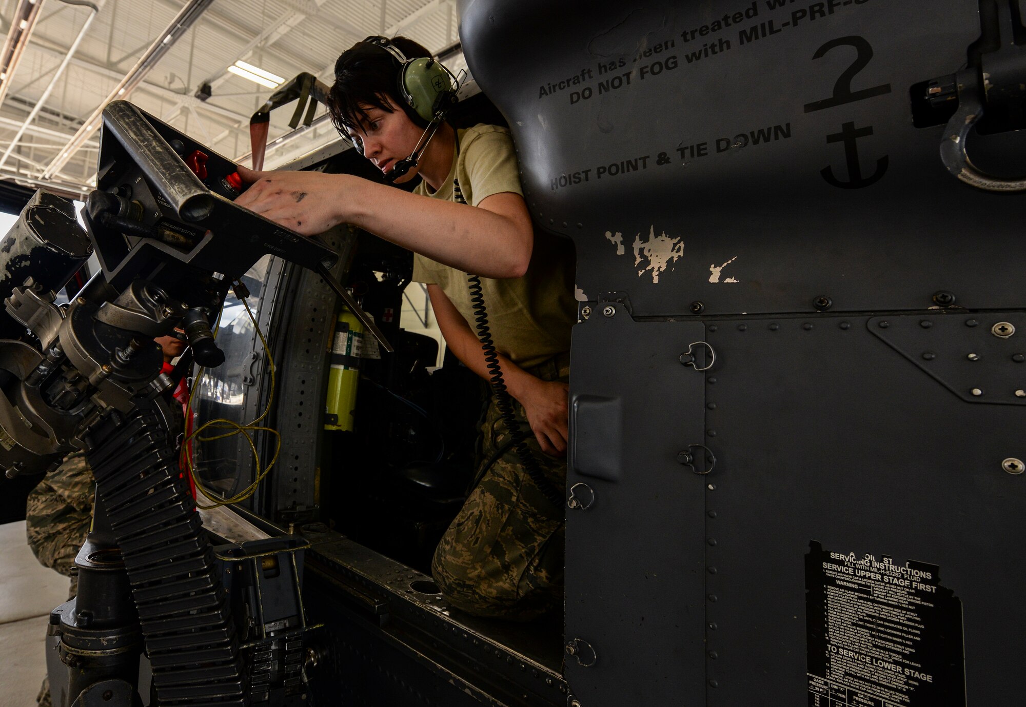 U. S. Air Force Senior Airman Skai Levoy, 41st Helicopter Maintenance Unit, performs an operational check on the firing controls of the GAU-2 7.62mm mini-gun Sept. 11, 2015, at Moody Air Force Base, Ga. Levoy helped the 41st HMU weapons flight defeat the HH-60G Pave Hawk units at Davis-Monthan AFB, Ariz. and Nellis AFB, Nev., to clench first place this quarter. (U.S. Air Force photo by Airman 1st Class Janiqua P. Robinson/Released) 