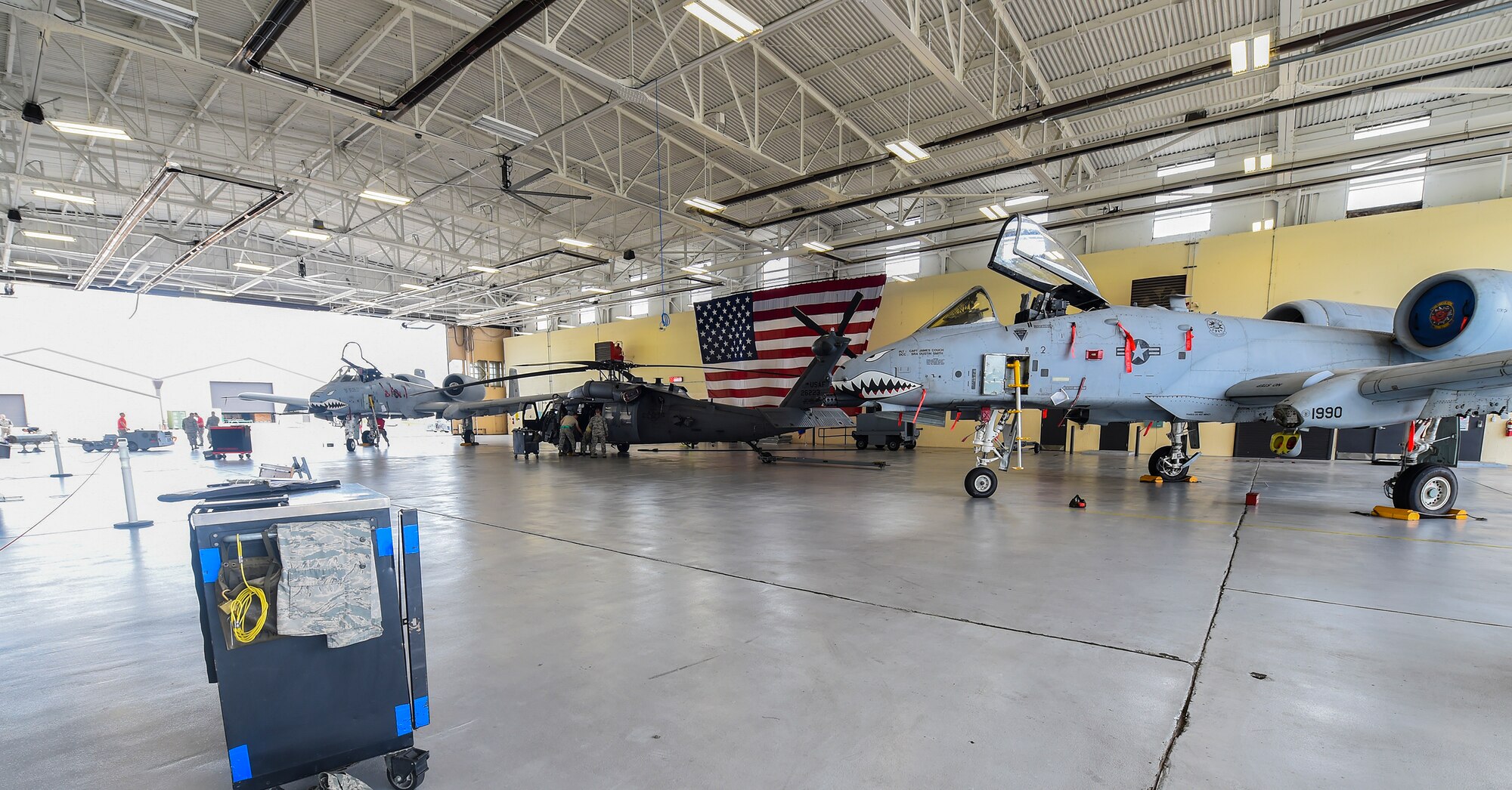Airmen from the 41st Helicopter Maintenance Unit and the 74th and 75th Aircraft Maintenance Units compete during the load crew of the quarter competition Sept. 11, 2015, at Moody Air Force Base, Ga. This is the first time a fixed-wing and rotary aircraft load competition has taken place simultaneously. The 74th and 75th AMU competed against each other and the 41st HMU competed against geographically separated units at Nellis AFB, Nev., and Davis-Monthan AFB, Ariz. (U.S. Air Force photo by Senior Airman Ceaira Tinsley/Released)