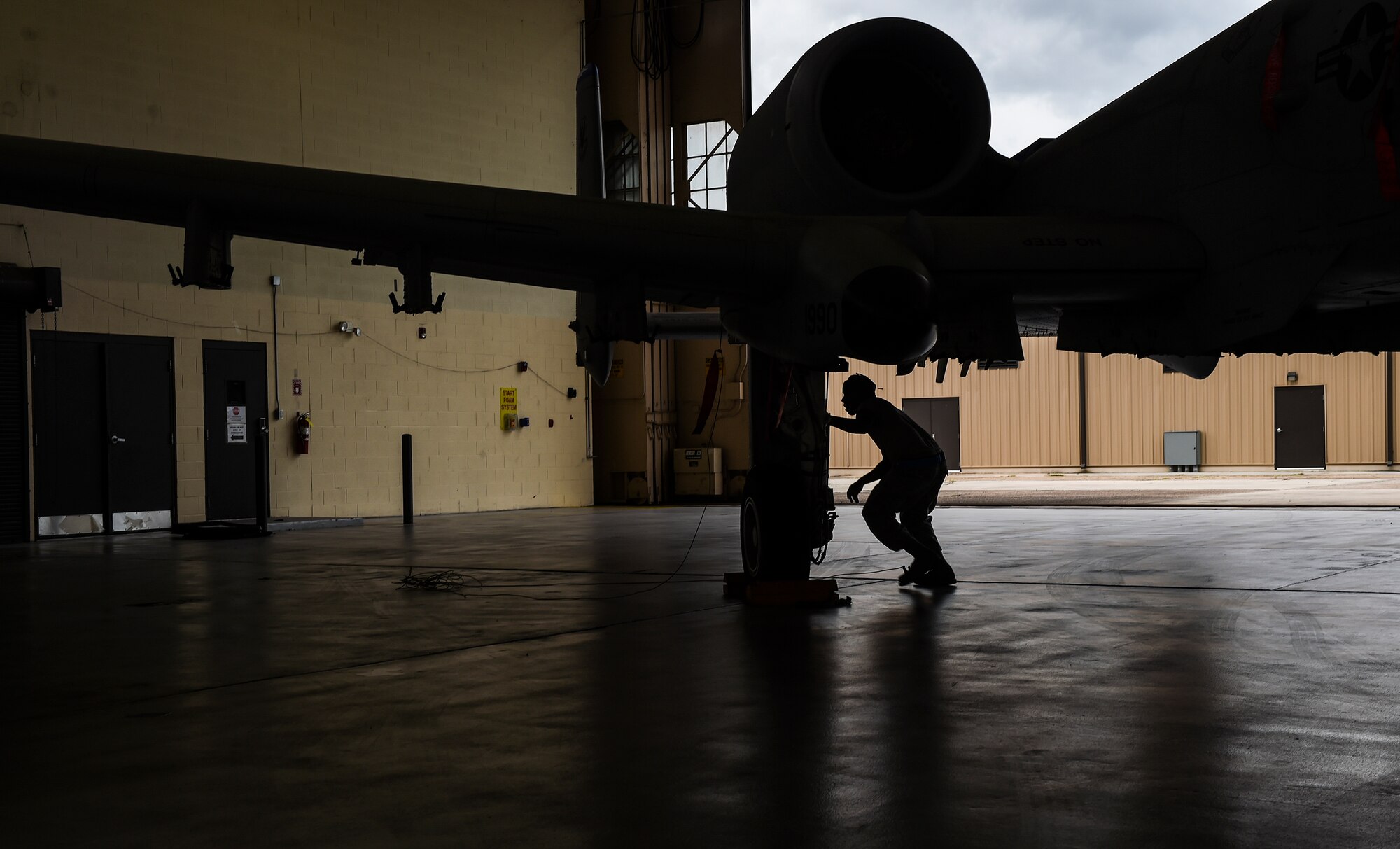 U.S. Air Force Senior Airman Tayrell Washington, 74th Aircraft Maintenance Unit weapons load crew member, completes functional checks during the load crew of the quarter competition Sept. 11, 2015, at Moody Air Force Base, Ga. The 74th and 75th AMUs were judged based on dress and appearance, a knowledge exam and loading various munitions to determine the quickest and most efficient load crew. (U.S. Air Force photo by Senior Airman Ceaira Tinsley/Released)