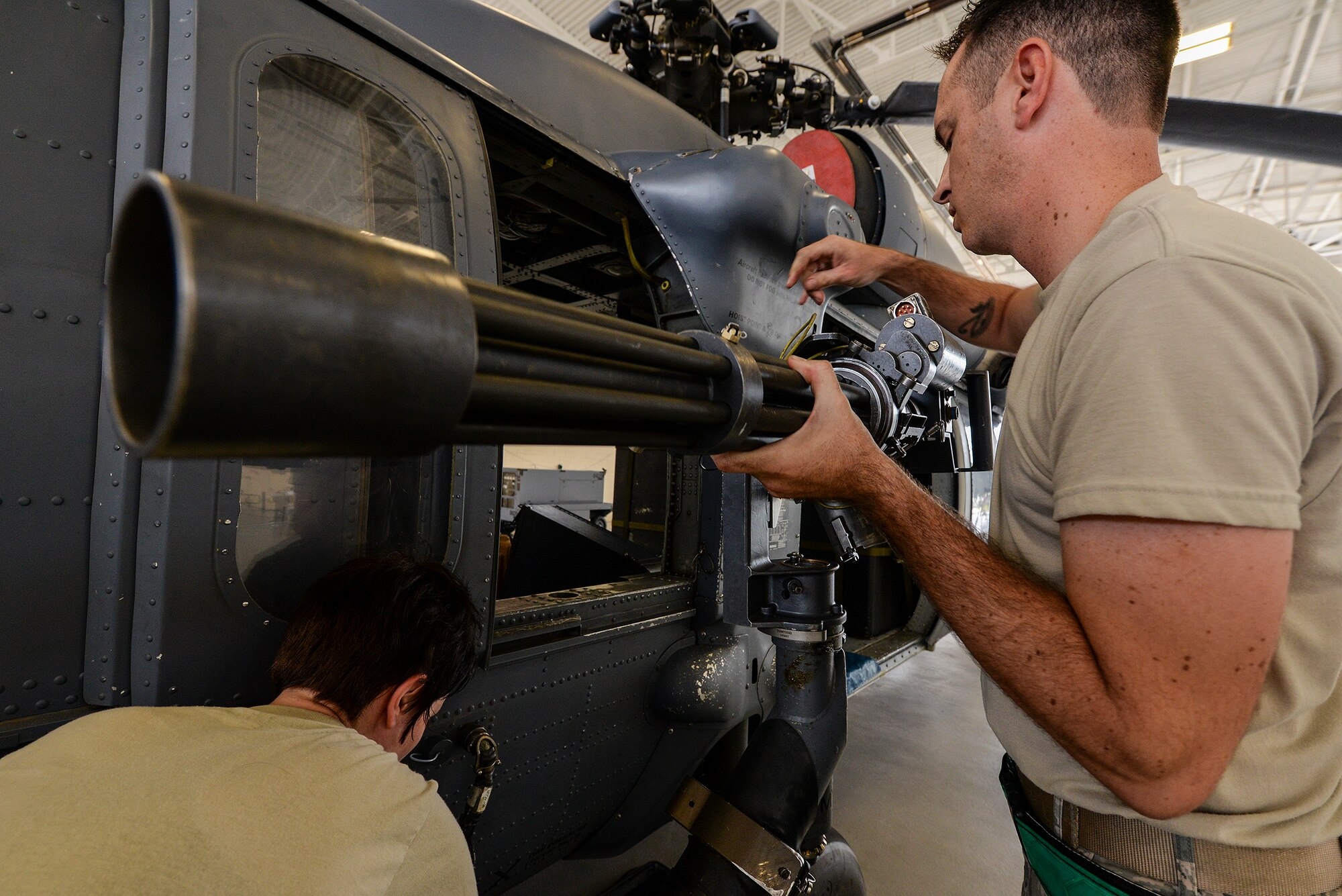 U. S. Air Force Staff Sgt. Michael Bellatoni, 41st Helicopter Maintenance Unit, performs an operational check on the GAU-2 7.62mm mini-gun on an HH-60G Pave Hawk  Sept. 11, 2015, at Moody Air Force Base, Ga. The HH-60 load competition is a new challenge that has been around for a year. (U.S. Air Force photo by Airman 1st Class Janiqua P. Robinson/Released) 