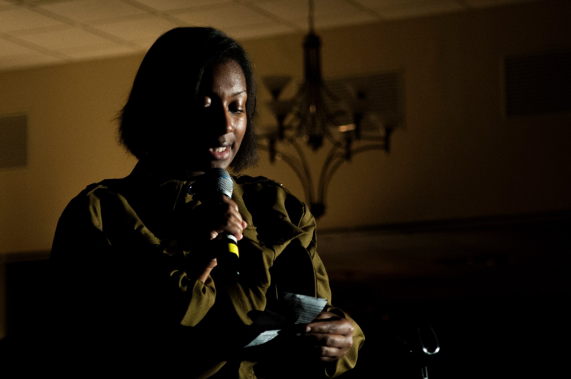 Airman 1st Class Charquelle Mattox, 4th Communications Squadron knowledge management technician, participates in a presentation of the Battle of Britain during the Air Force Ball, Sept. 12, 2015, at Seymour Johnson Air Force Base, North Carolina. The performance featured Airmen throughout the wing portraying fictional characters of various occupations during the Battle of Britain, and how each of their roles played a part in the victory. (U.S. Air Force photo/Airman 1st Class Shawna L. Keyes)