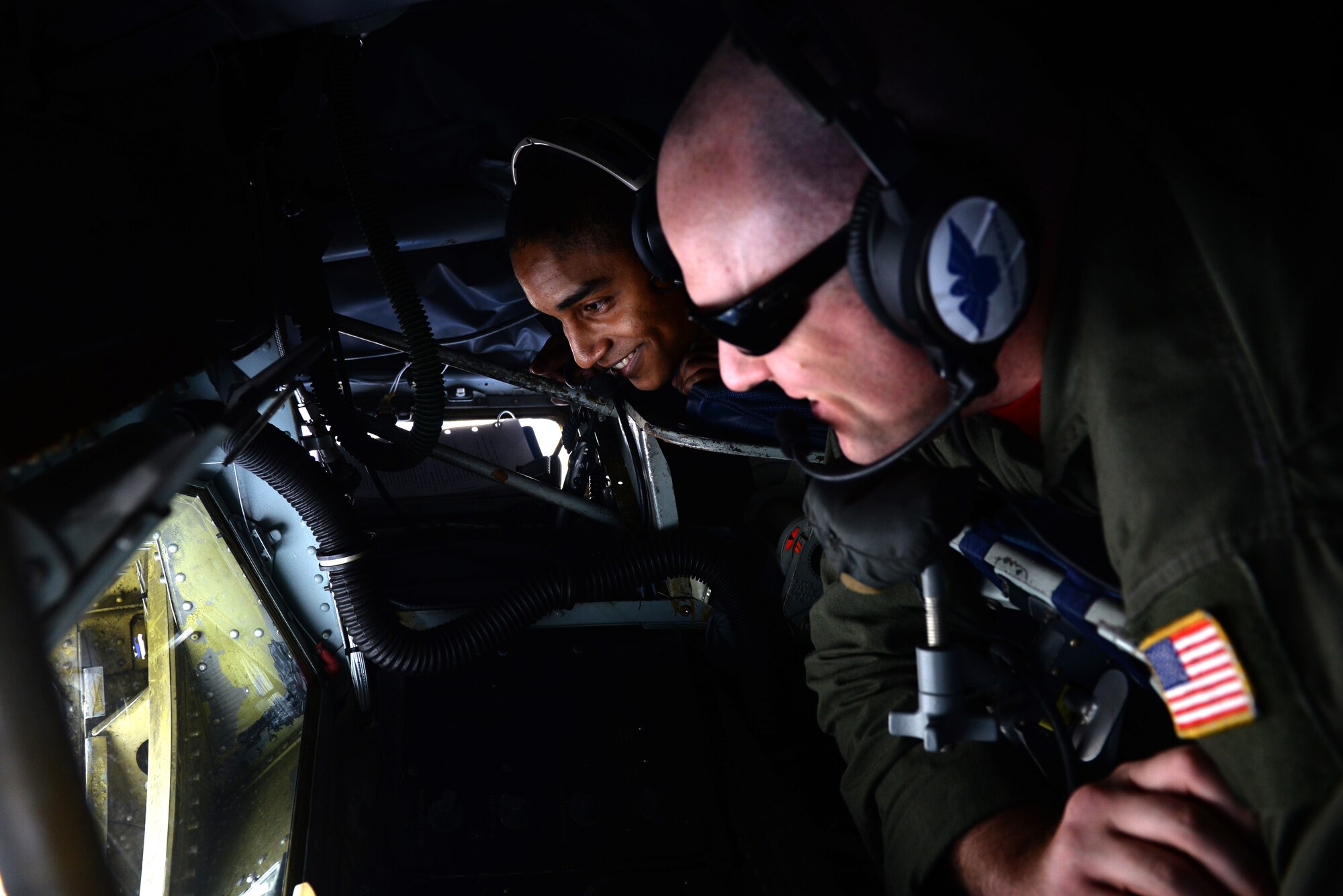 Airman 1st Class Timothy Gradney-McCastle (left), 911th Air Refueling Squadron boom operator, trains with Tech. Sgt. Tony Montani 911th ARS boom operator, while waiting to refuel an F-22 Raptor, Sept. 11, 2015. The refueling operation was part of Exercise Razor Talon, a monthly, large-force training opportunity for joint East Coast tactical and support aviation units. (U.S. Air Force photo/Airman 1st Class Ashley Williamson)