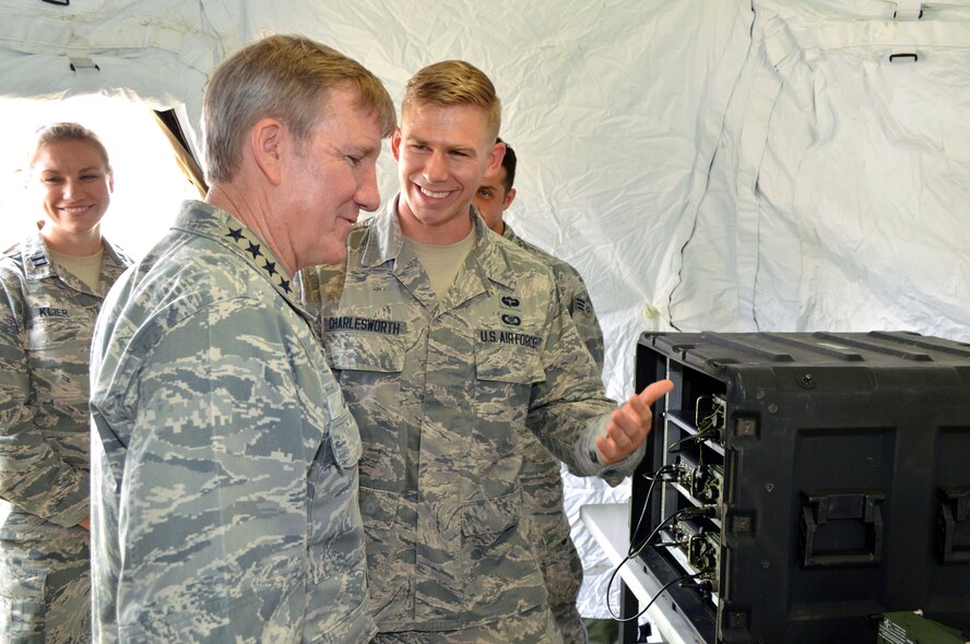U.S. Air Force Gen. Hawk Carlisle, commander of Air Combat Command, receives a mission briefing from Airman 1st Class Troy Charlesworth, a tactical air command and control specialist assigned to the 682nd Air Support Operations Squadron, about air support operations center operations and how he receives close air support requests and disseminates air assets to joint terminal attack controllers on the battlefield. Carlisle visited 18th Air Support Operations Group battlefield Airmen at Pope Army Airfield, North Carolina, Sept. 9. (U.S. Air Force photo/Marvin Krause)