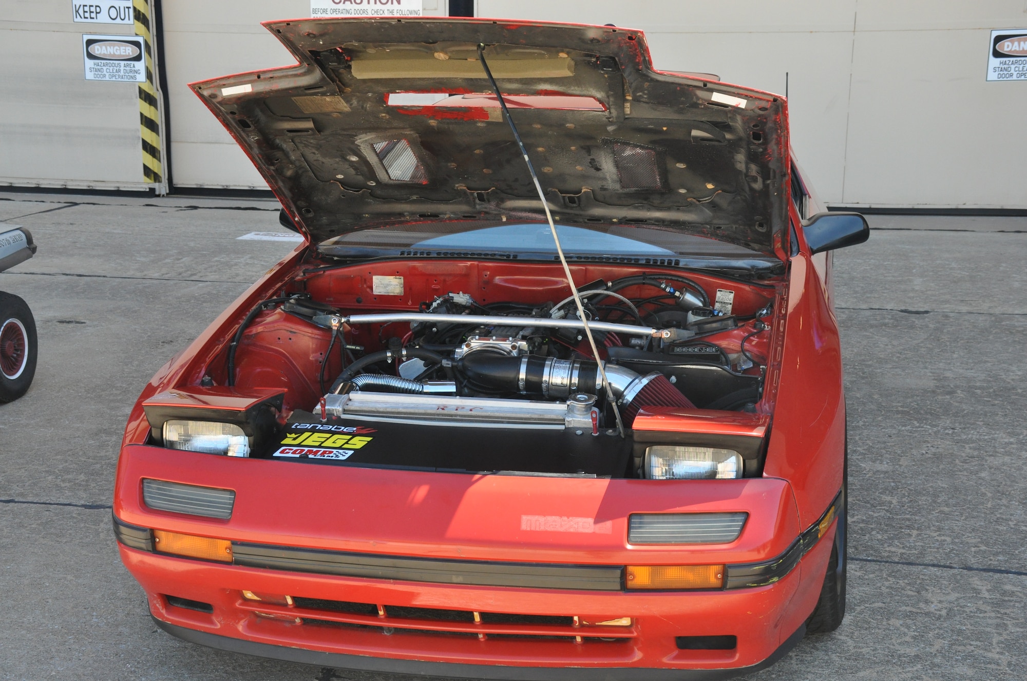 A view under the hood of a 1988 Mazda RX-7 of the 507th Air Refueling Wing's Family Day Car Show Sept. 12, 2015 at Tinker Air Force Base, Okla. The RX-7 took first place in the competition, belonging to Staff Sgt. Mark Peralta of the 507th Aircraft Maintenance Squadron. (U.S. Air Force photo by Tech. Sgt. Charles Taylor)
