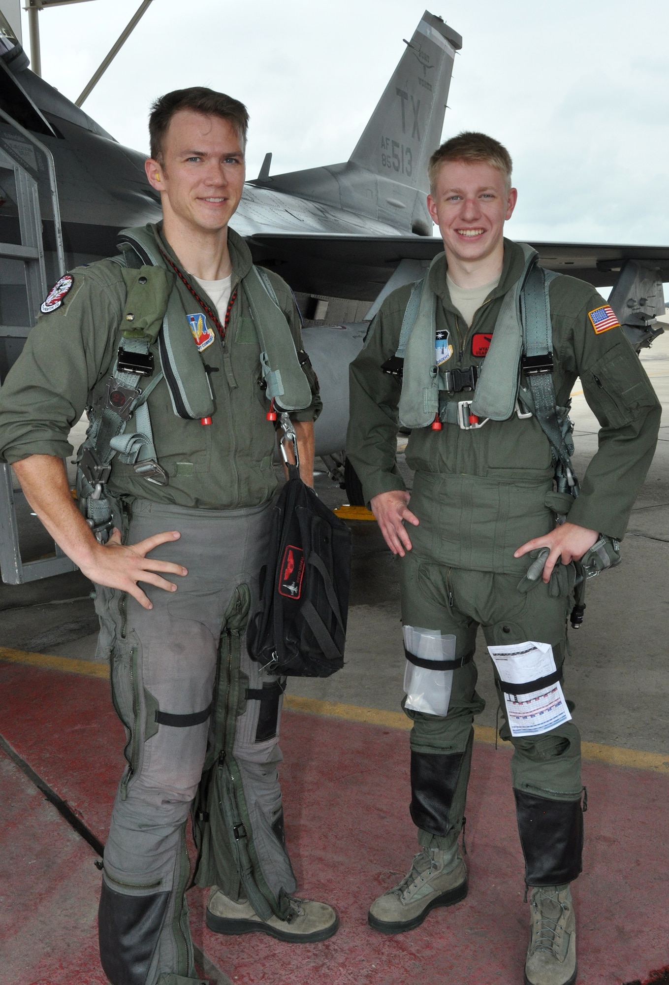 NAVAL AIR STATION FORT WORTH JOINT RESERVE BASE, Texas - Capt. Nicholas Hanna, an active duty F-16 pilot assigned to Detachment 457, and U.S. Air Force Academy Cadet Wyatt Kelly, pose for a photo following an orientation flight in an F-16 June 21 here. These flights are not only a unique opportunity for cadets, but also introduce cadets to military flying operations and motivate those considering a career as a pilot. (U.S. Air Force photo by Master Sgt. Julie Briden-Garcia)