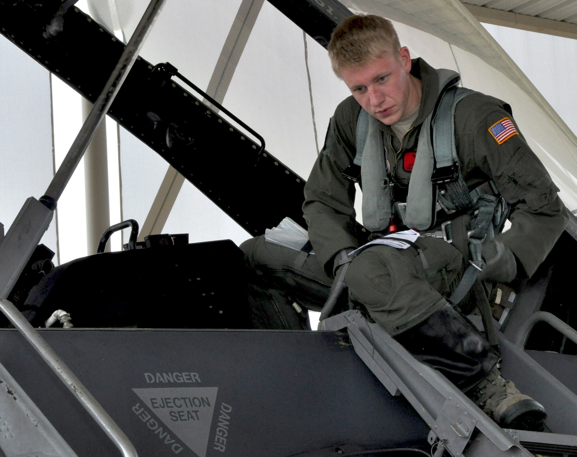 NAVAL AIR STATION FORT WORTH JOINT RESERVE BASE, Texas - United States Air
Force Academy cadet, Wyatt Kelly, exits the cockpit June 16 after his F-16 orientation flight at Naval Air Station Fort Worth Joint Reserve Base, Texas. The 457th Fighter Squadron flew two cadets this summer to offer them better insight into what being a pilot. (U.S. Air Force photo by Master Sgt. Julie Briden-Garcia)