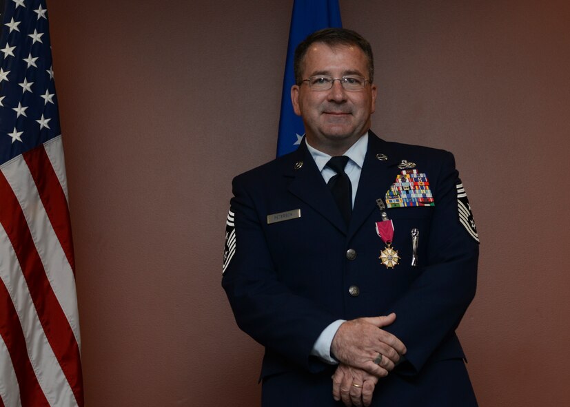 Chief Master Sgt. Kevin Peterson, 28th Bomb Wing command chief, addresses friends, family and fellow servicemembers during his retirement ceremony at Ellsworth Air Force Base, S.D., Aug. 21, 2015. Peterson’s 30 years of service culminated with three years as the 28th BW command chief. (U.S. Air Force photo by Senior Airman Anania Tekurio/Released)