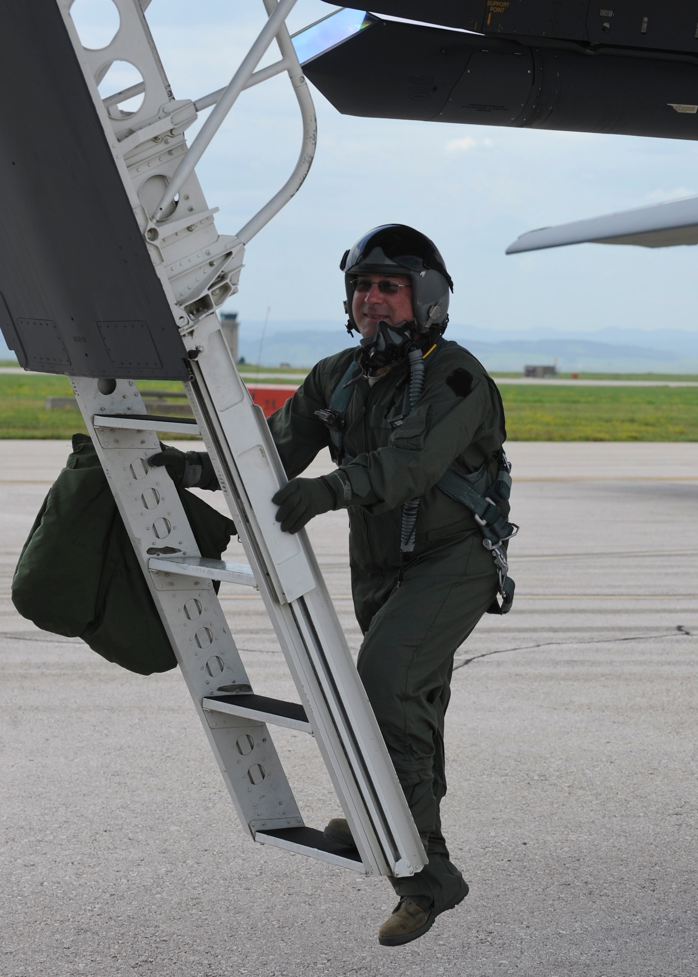 Chief Master Sgt. Kevin Peterson, 28th Bomb Wing command chief, prepares for an incentive flight in a B-1 bomber at Ellsworth Air Force Base, S.D, June 30, 2015. Peterson’s flight was in recognition of his leadership as wing command chief and 30 years military service to the U.S. Air Force. (U.S. Air Force photo by Senior Airman Anania Tekurio/Released) 