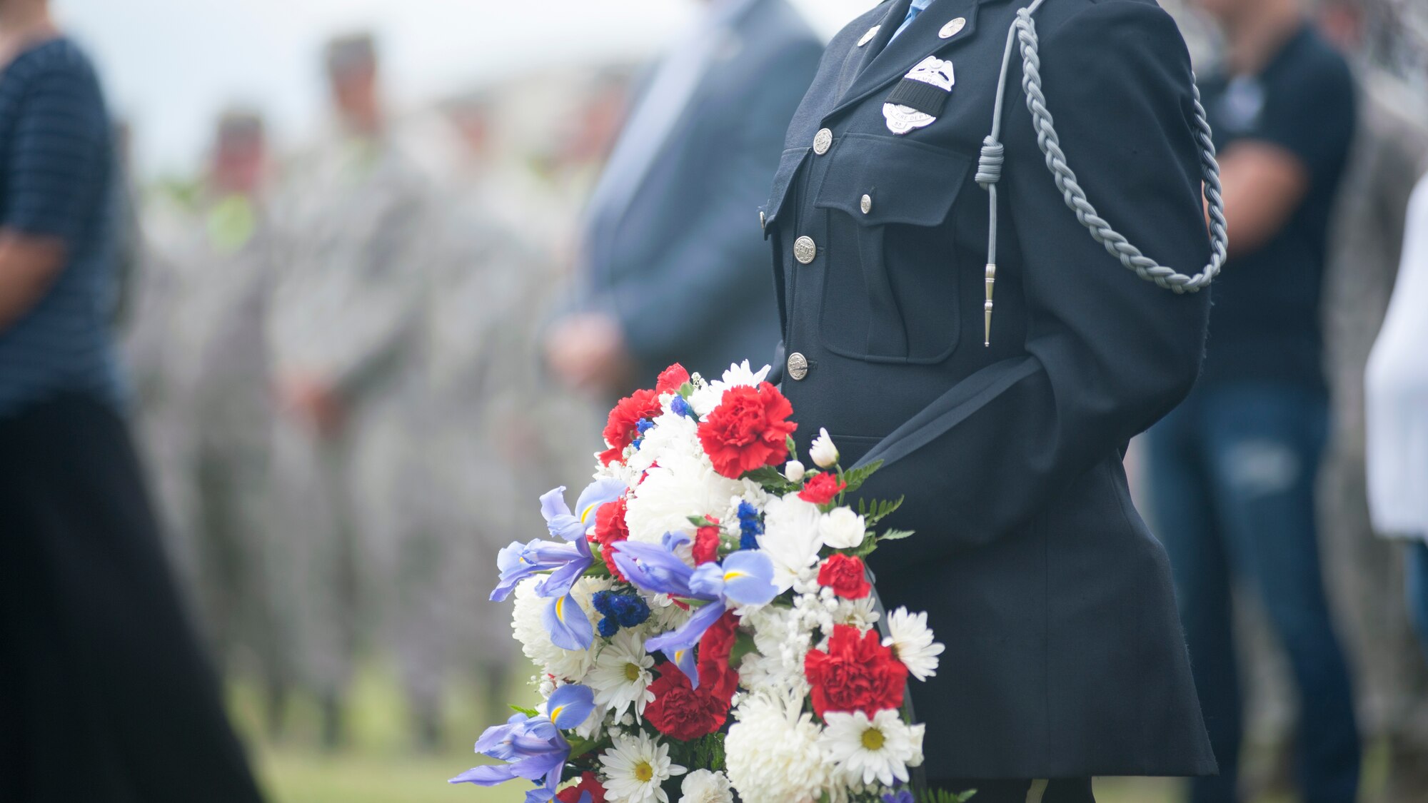A Magnolia Volunteer Fire Company firefighter holds a wreath during the 9/11 memorial service Sept. 11, 2015, at the Air Mobility Command Museum on Dover Air Force Base, Del. The wreath was placed in front of the memorial to remember those lost during and after the attacks of Sept. 11, 2001. (U.S. Air Force photo/Staff Sgt. Jared Duhon)