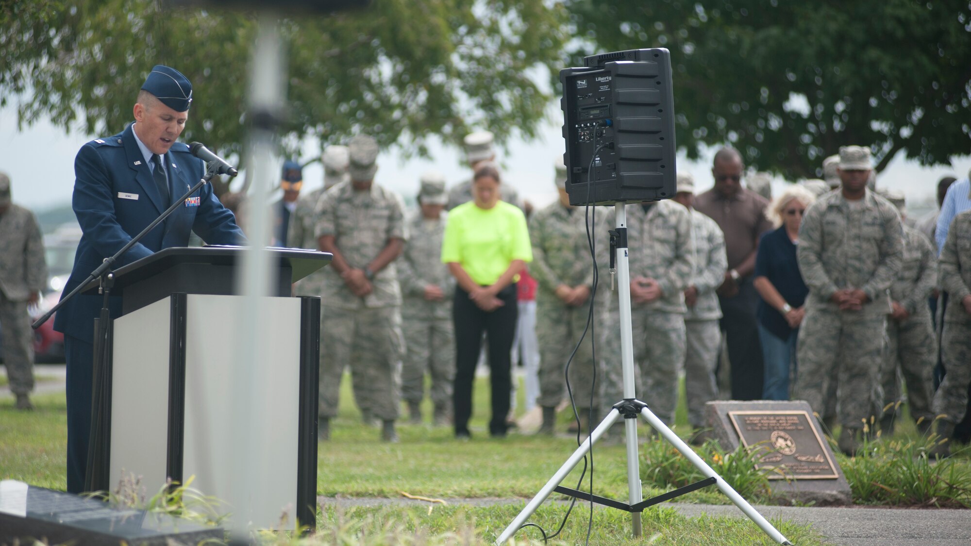 Chaplain (Capt.) Quentin Genke, 436th Airlift Wing chaplain, gives the invocation during the 9/11 memorial service Sept. 11, 2015, at the Air Mobility Command Museum on Dover Air Force Base, Del. The event was held at Dover AFB’s September 11th memorial, which was complete in 2013 and holds items from the different locations directly affected by the attacks. (U.S. Air Force photo/Staff Sgt. Jared Duhon)