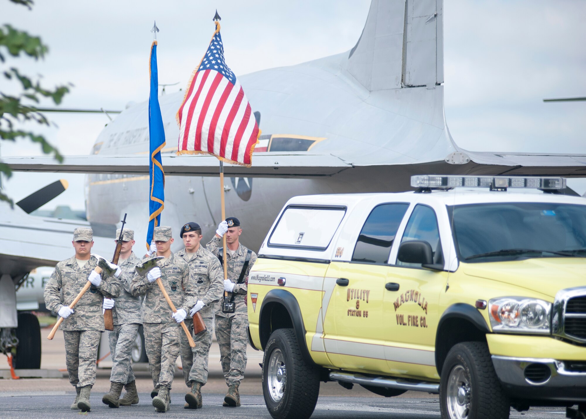 Members of the 436th Civil Engineer Squadron and 436th Security Forces Squadron carry the colors during the 9/11 memorial service Sept. 11, 2015, at the Air Mobility Command Museum on Dover Air Force Base, Del. The team was comprised of Dover AFB emergency responders. (U.S. Air Force photo/Staff Sgt. Jared Duhon)