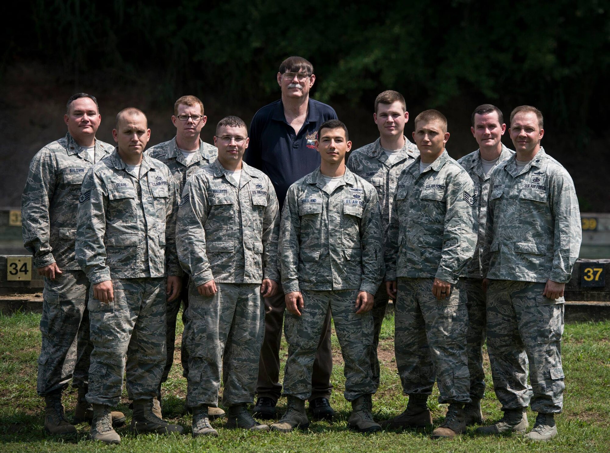 Members of the Air Force National Pistol Team pose for a team photo during the Annual Interservice Pistol Championships June 8, 2015, at Fort Benning, Ga. The team placed fifth in the competition consisting of several pistol matches that are made up of three stages of fire; slow, timed and rapid. (U.S. Air Force photo/Staff Sgt. Andrew Lee)