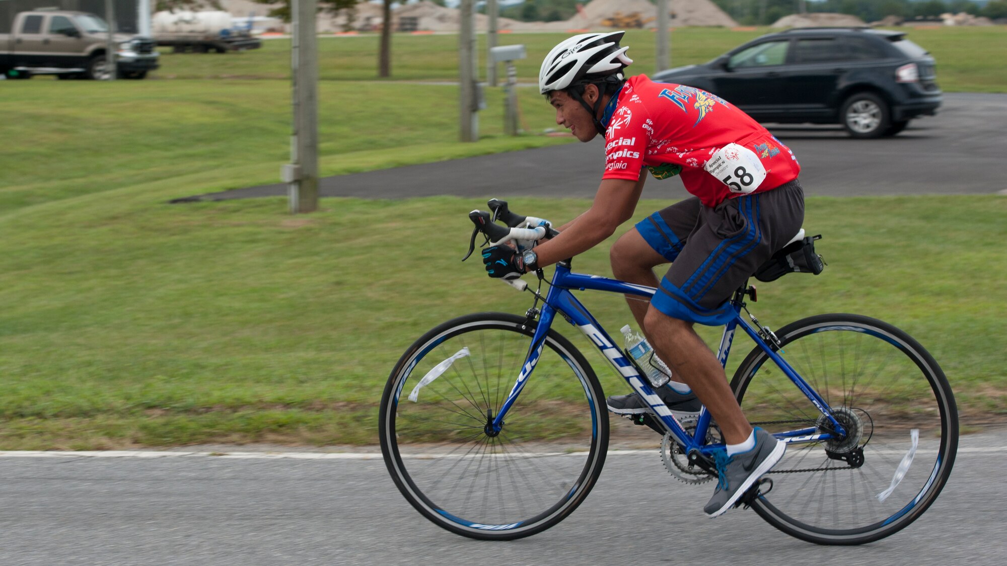 Danny Garcia, Team Flying Eagles cyclist, races down Perimeter Road during the 2015 Special Olympics Cycling Classic Sept. 12, 2015, at Dover Air Force Base, Del. Garcia was one of 70 riders to participate in the annual event. (U.S. Air Force photo/Airman 1st Class Zachary Cacicia)